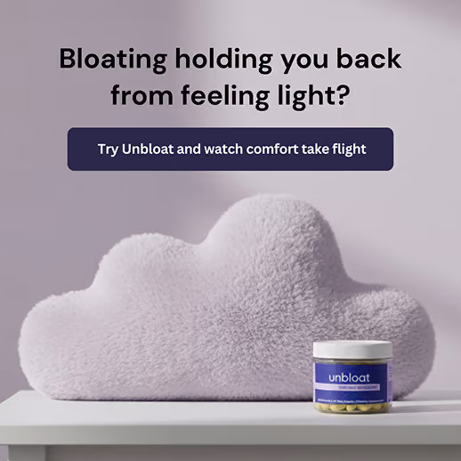 Unbloat supplement jar next to a fluffy cloud-shaped pillow.