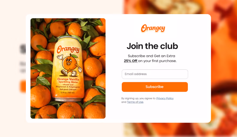 Orangey sparkling water can nestled among fresh oranges.