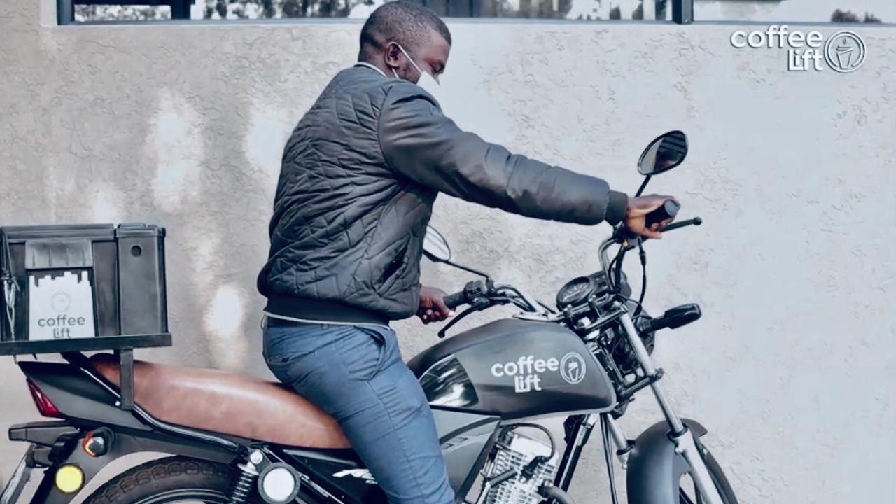 Delivery driver on Coffee Lift motorbike