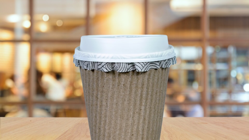 take-away coffee cup in a coffee shop