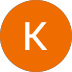 White letter "K" on orange circle background.
