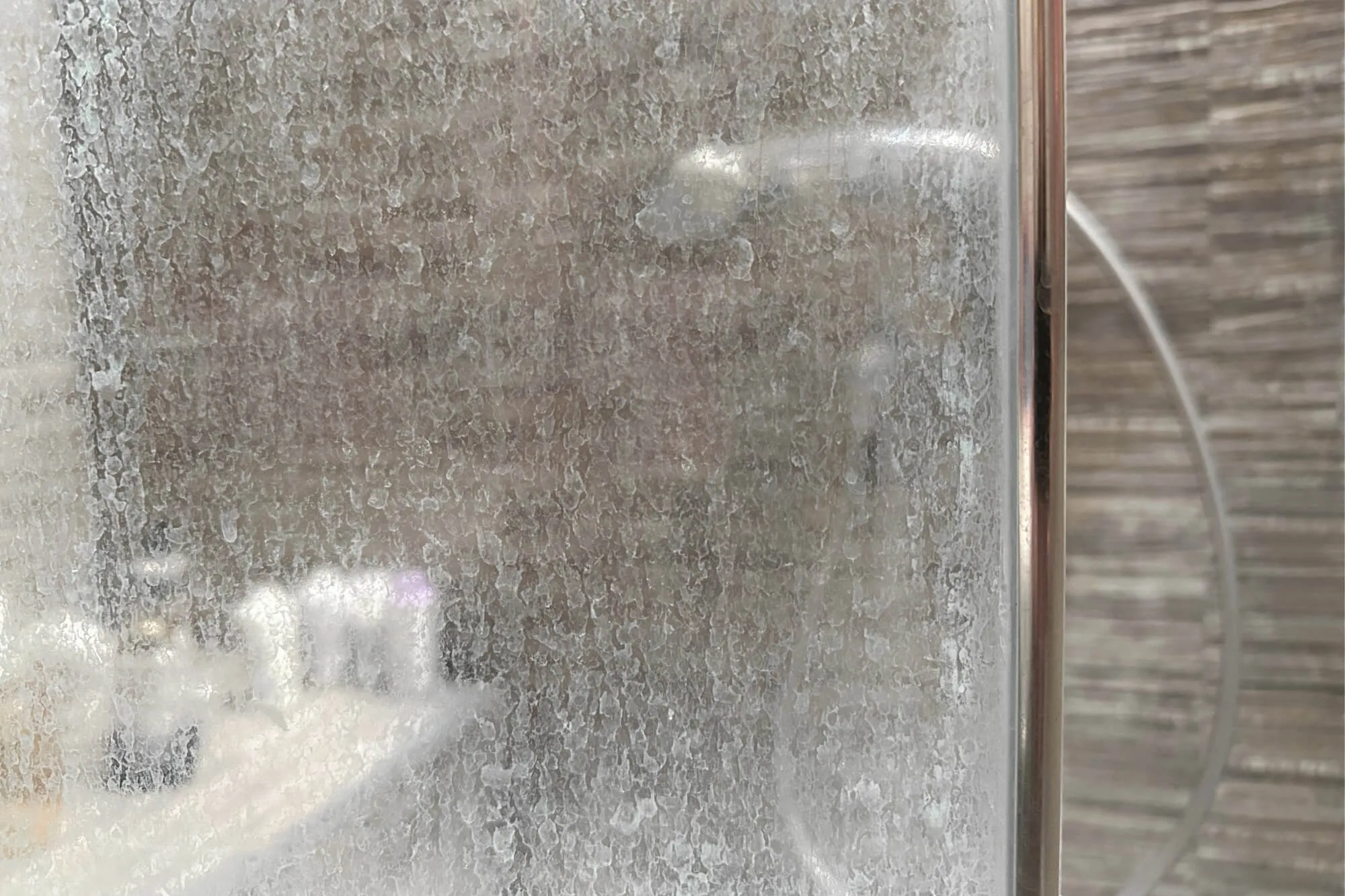 Hard water stains on shower glass