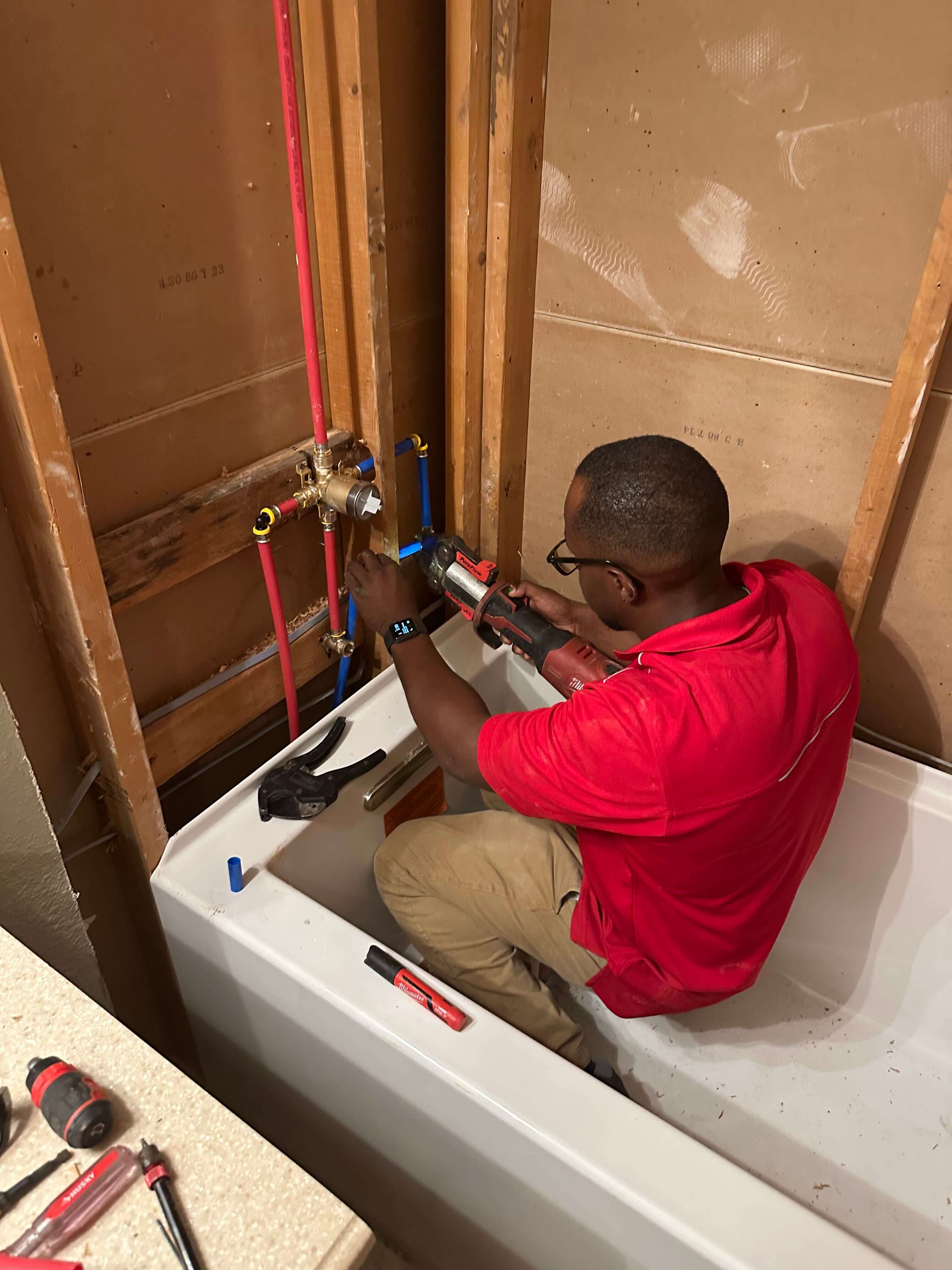 Cold Is On The Right plumber installing PEX water supply lines during a bathroom plumbing fixture repair in Austin, TX