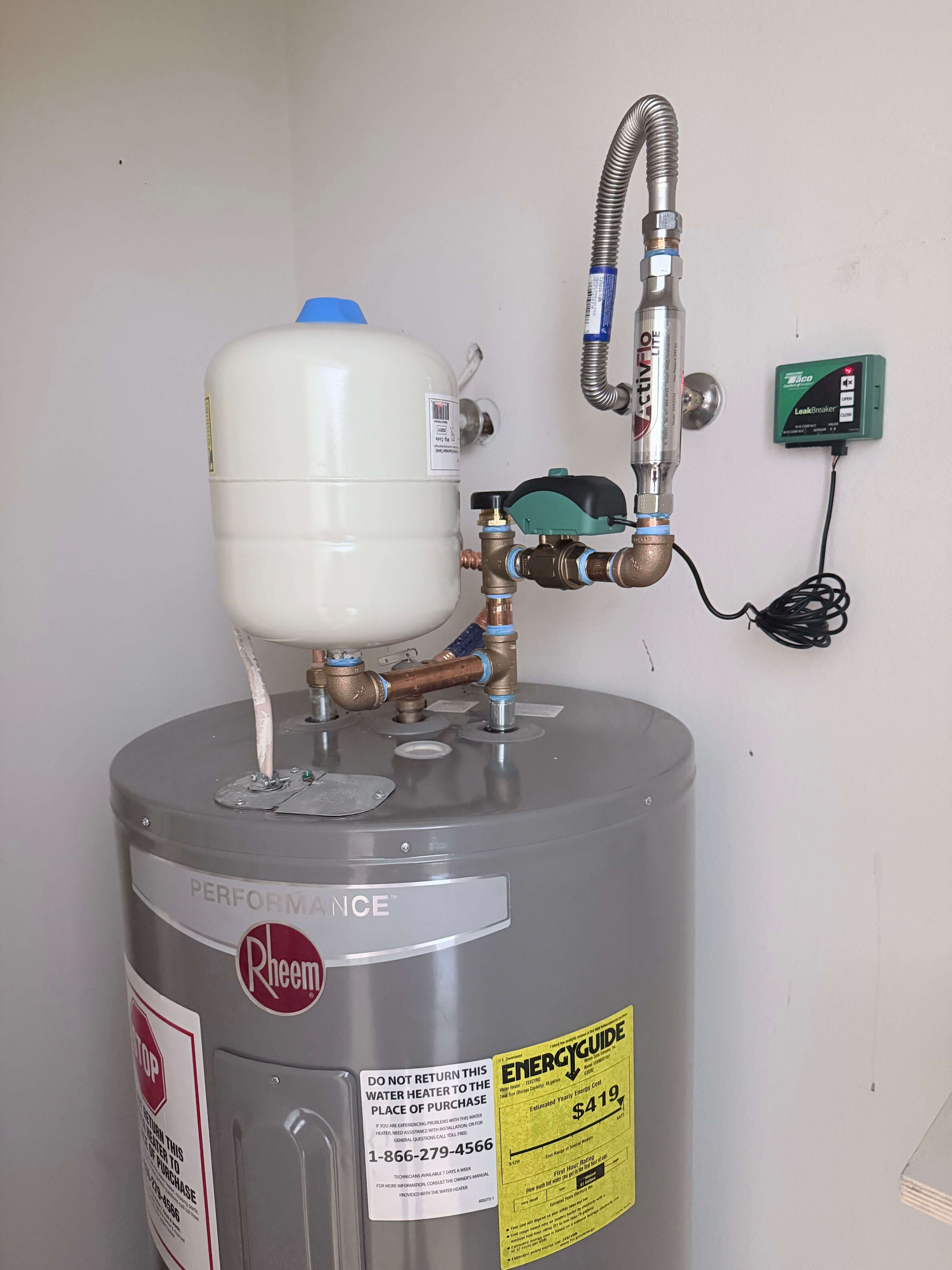 Professional water heater installation by Cold Is On The Right Plumbing, featuring a Rheem Performance unit with expansion tank and recirculation pump in Austin, TX