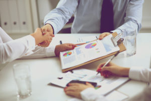 Business team are showing unity with their hands.