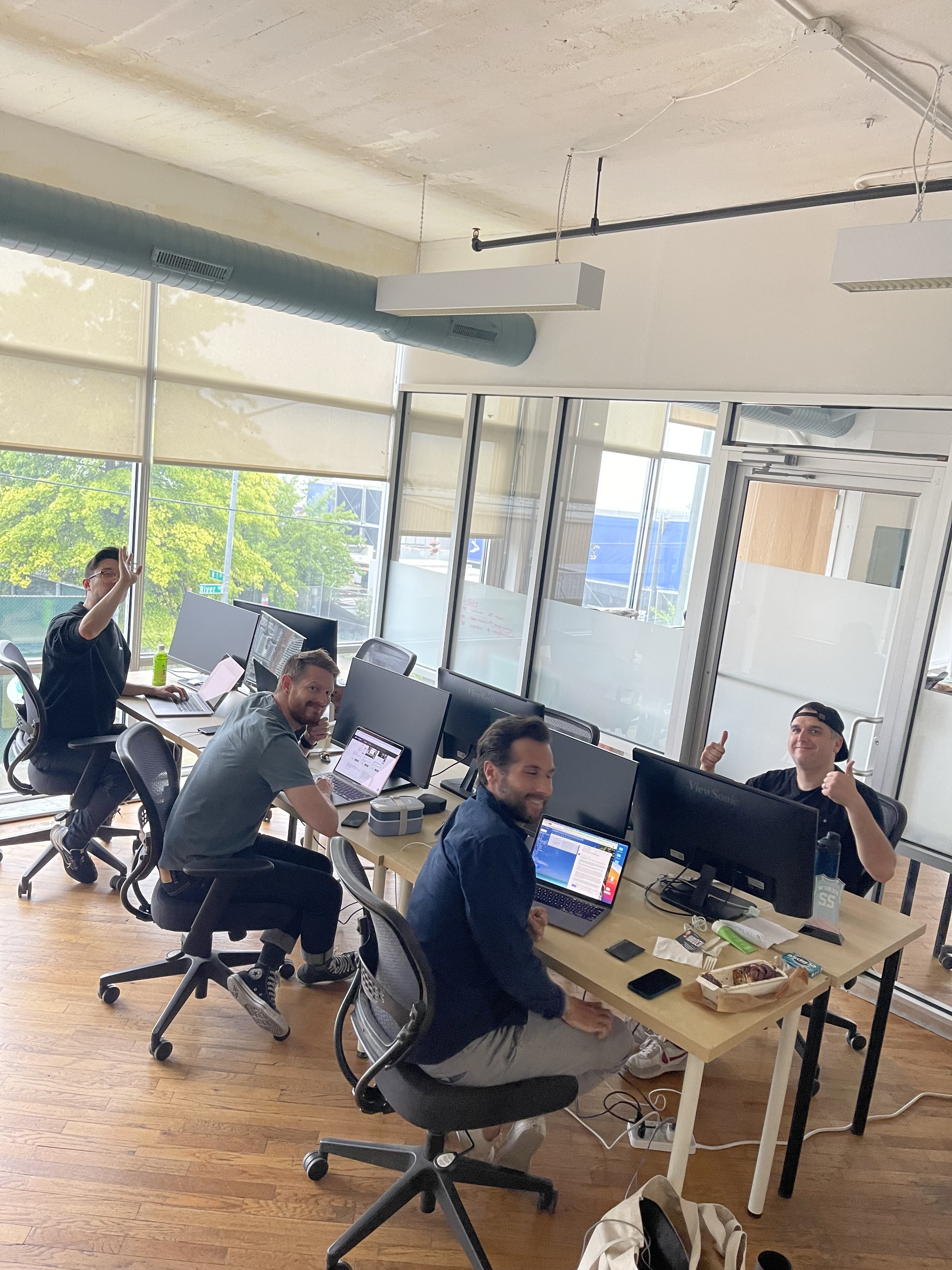 Team of workers collaborating in a bright, modern open-plan office workspace