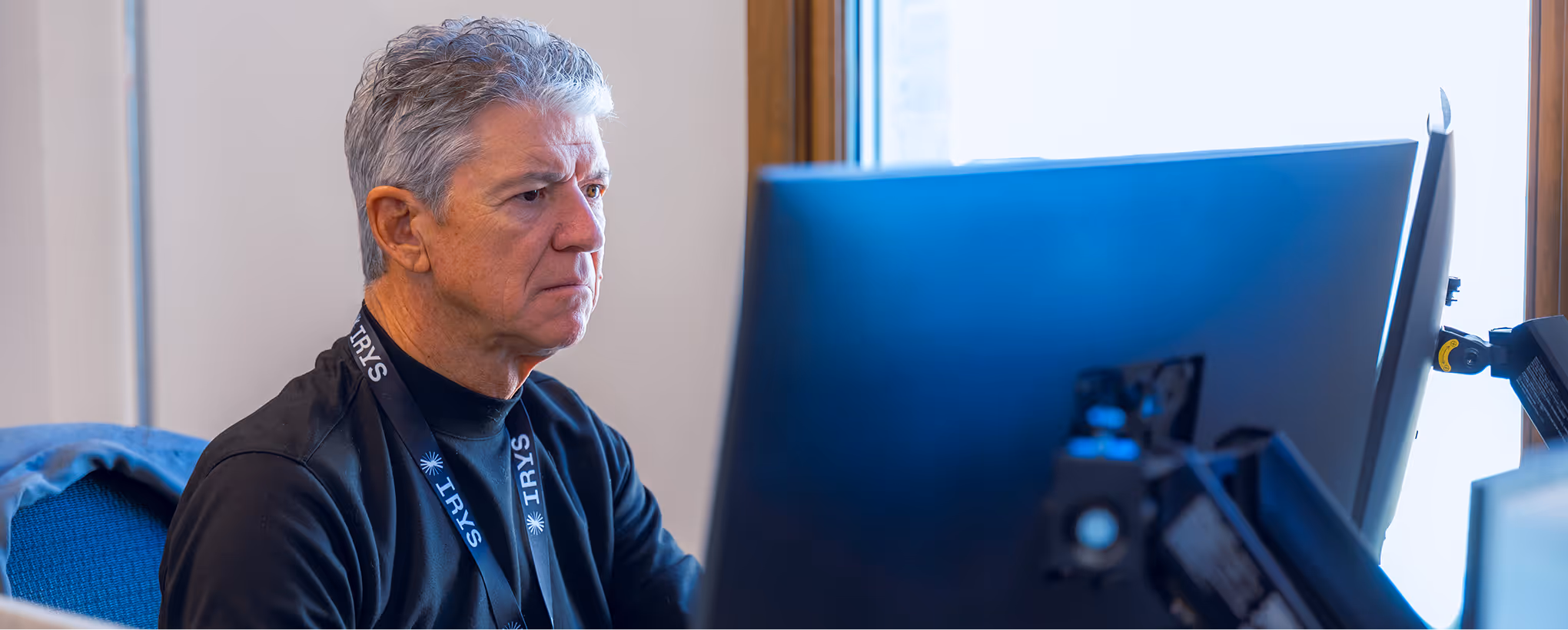 Irys employee working on computer