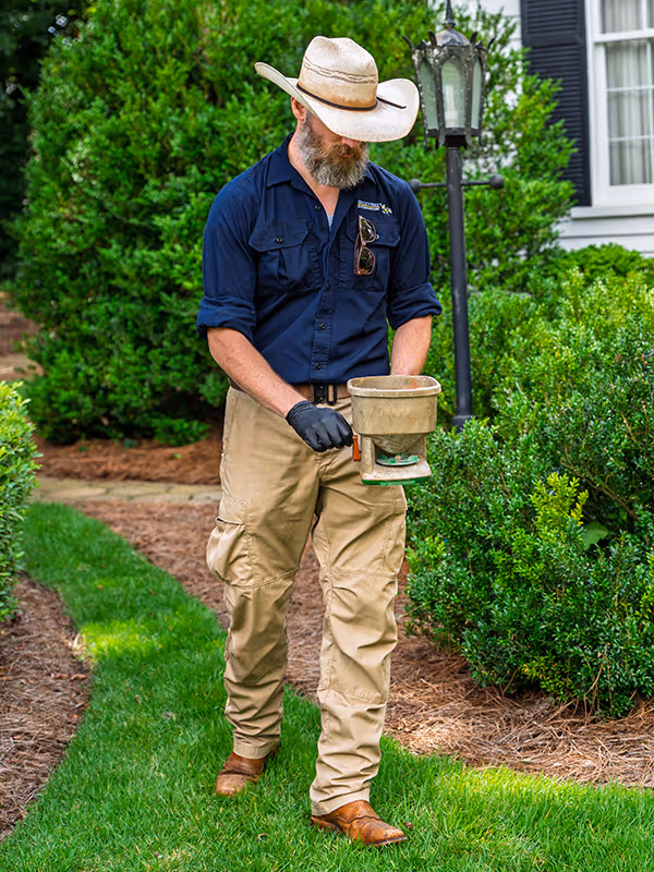 exterminator treating yard