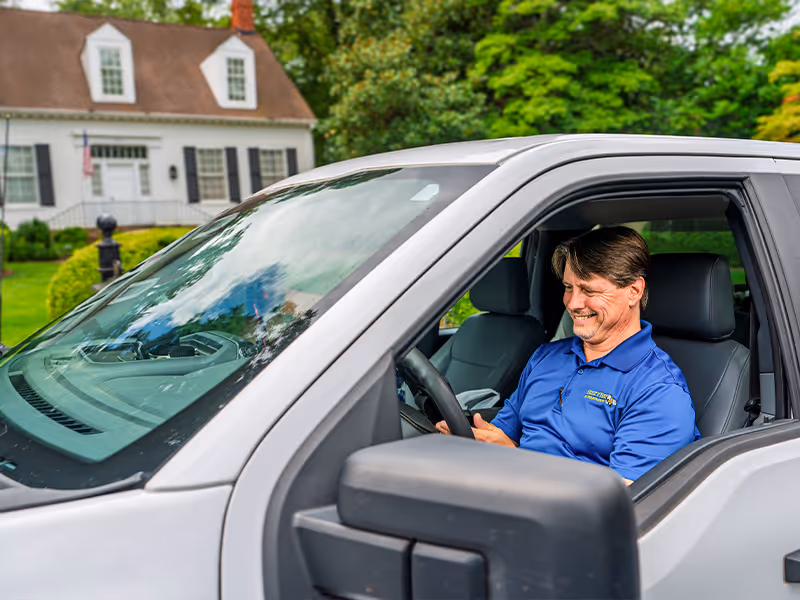 pest control specialist getting ready to inspect home