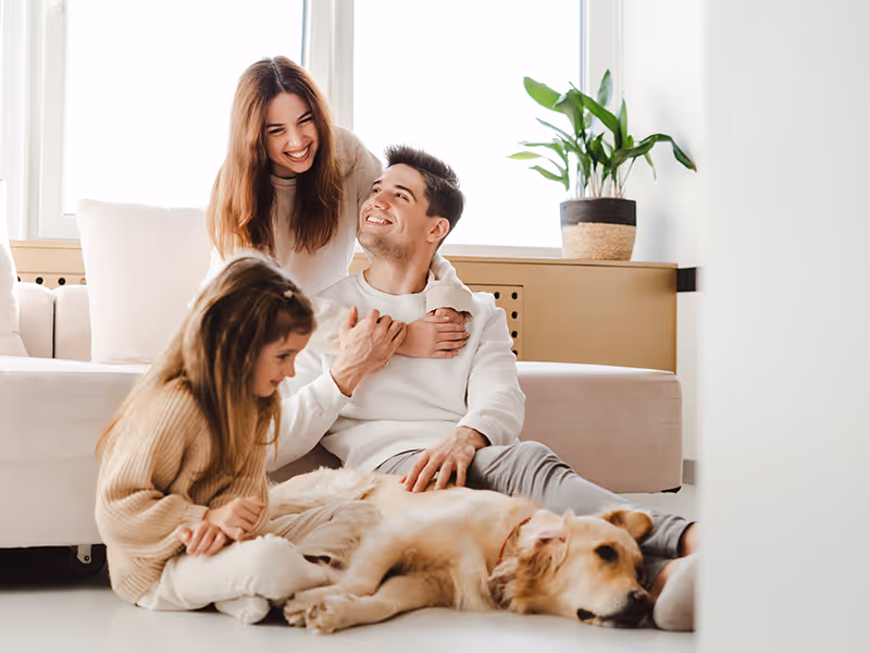 family relaxing on couch