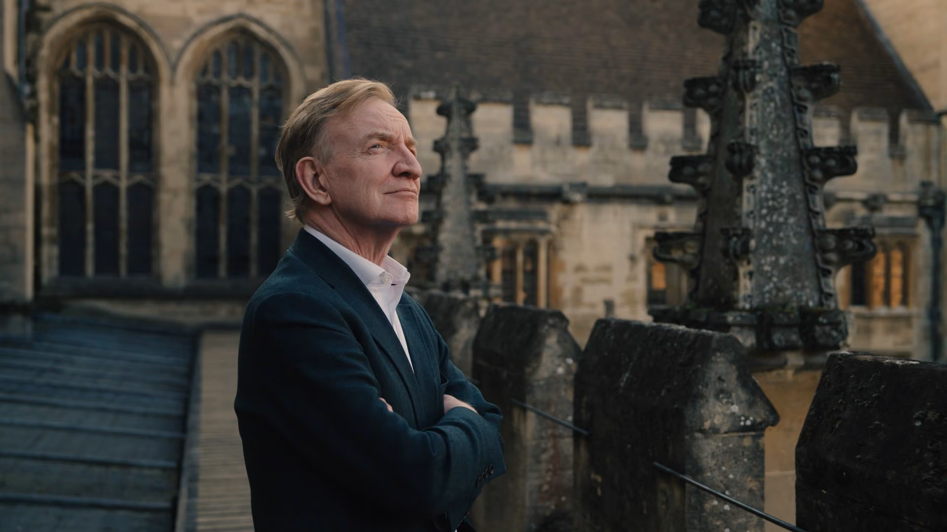 An inventor featured in the series outside a historic university building — IVORY portrait series for the EPO
