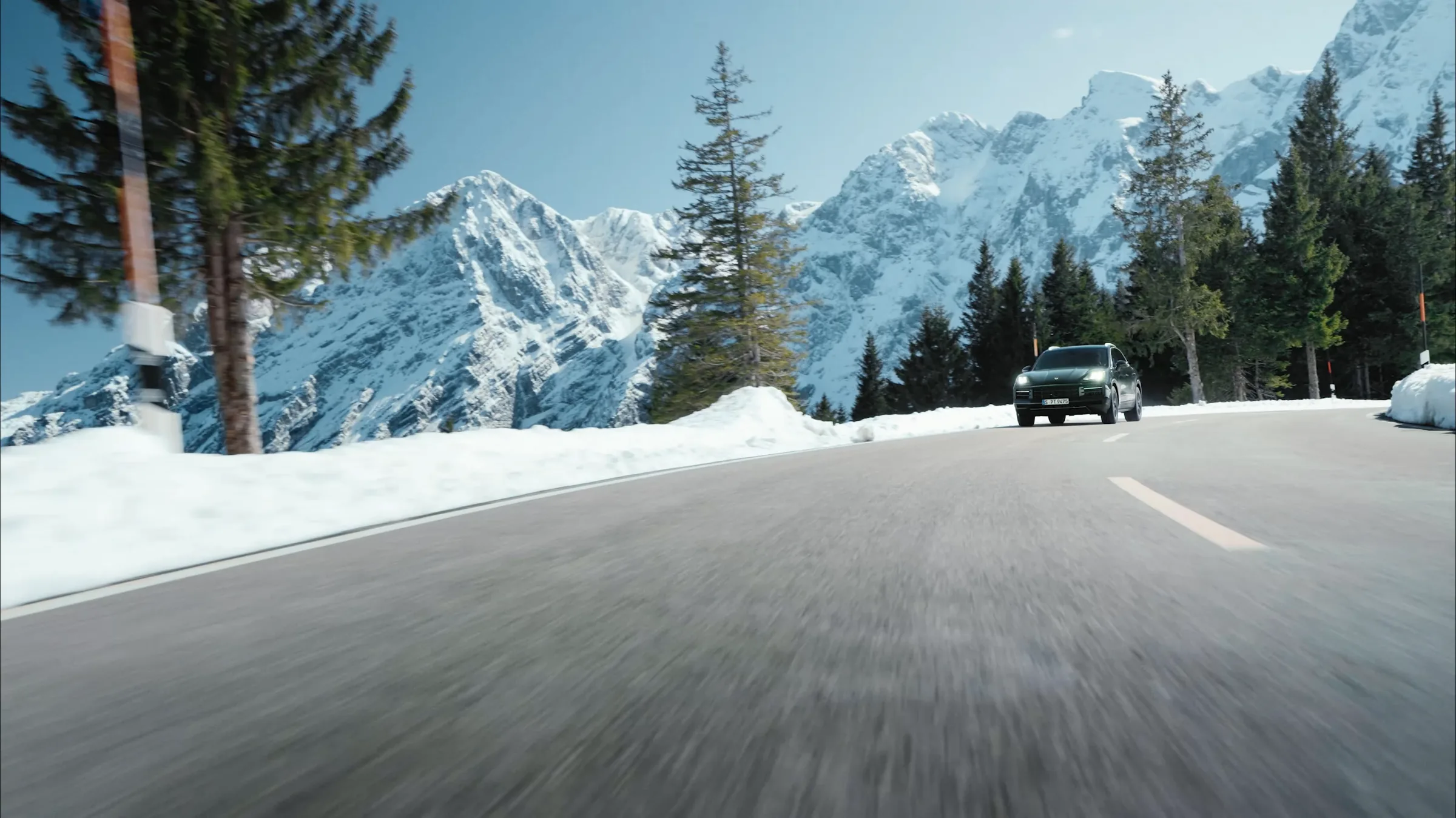 Porsche Cayenne Active on a mountain road in the Berchtesgaden Alps, film still by IVORY Productions