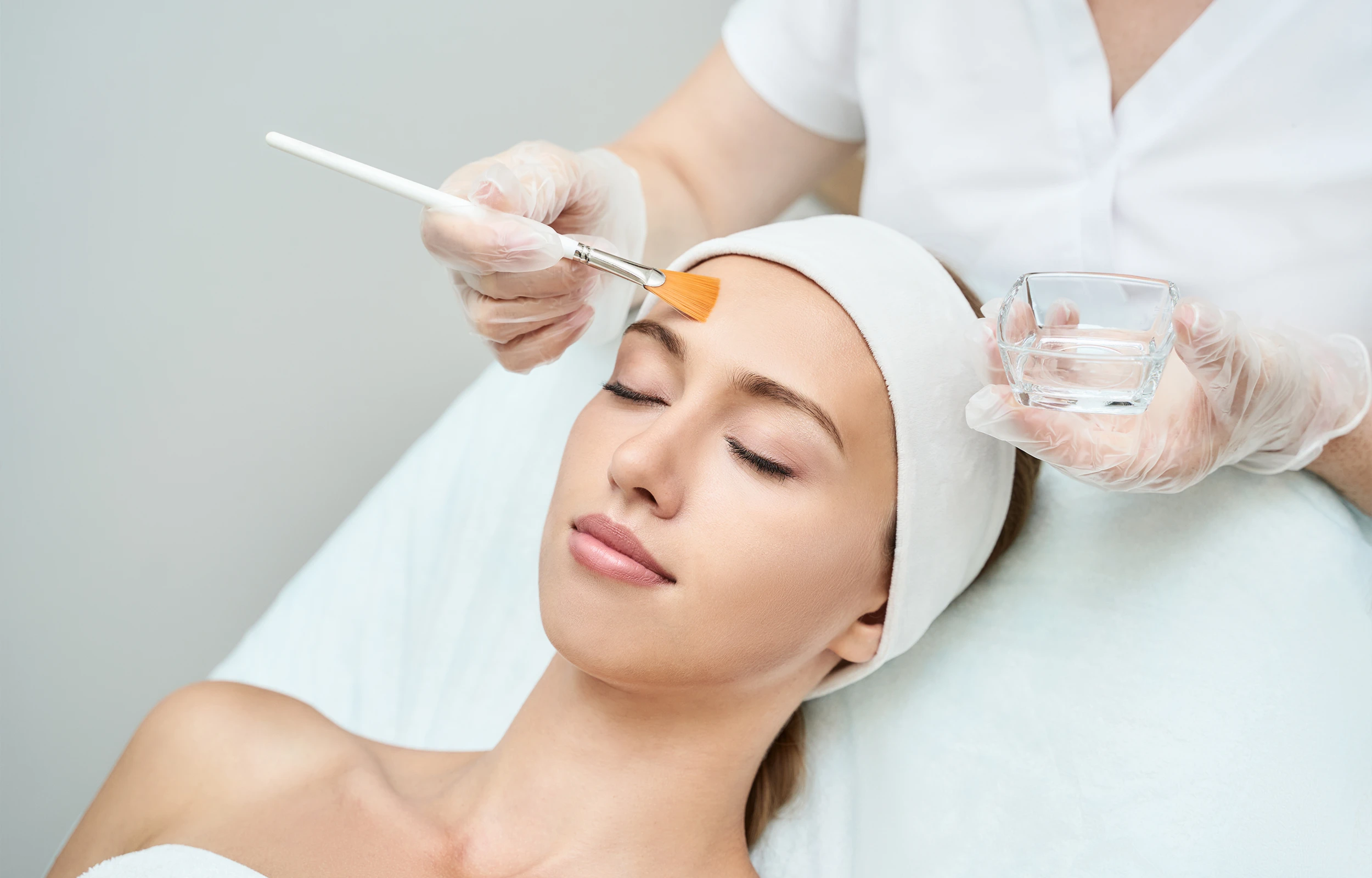 A woman getting a chemical peel at medical spa