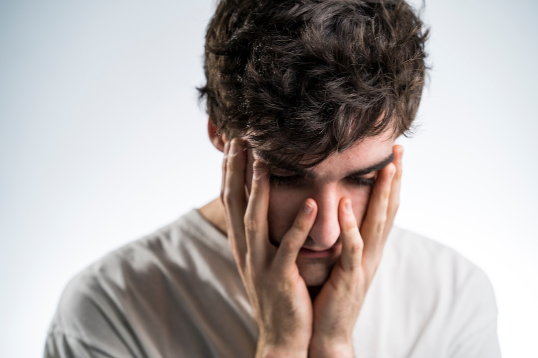 Man experiencing symptoms like fatigue and brain fog - HRT for men