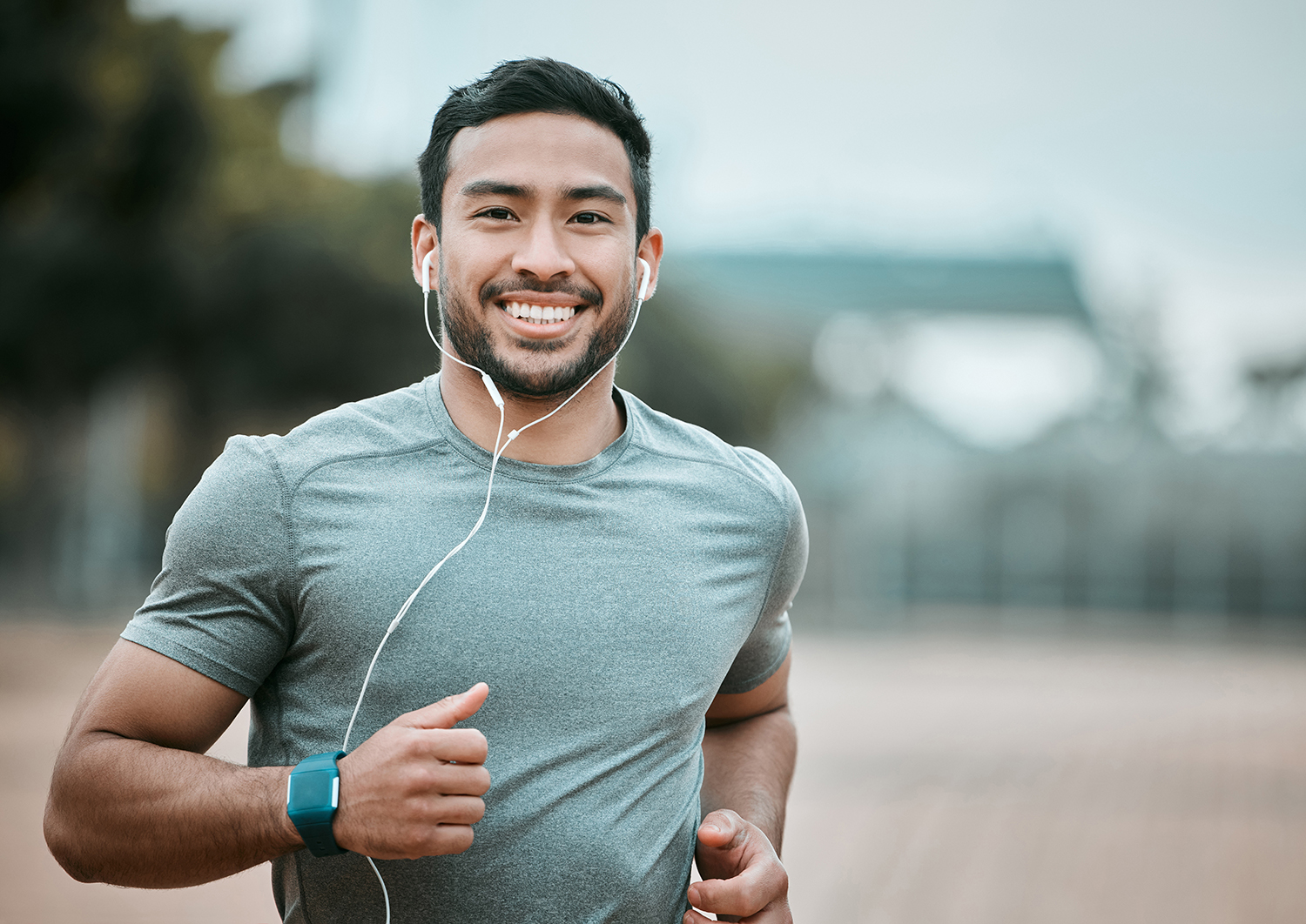 Happy man running with earphones
