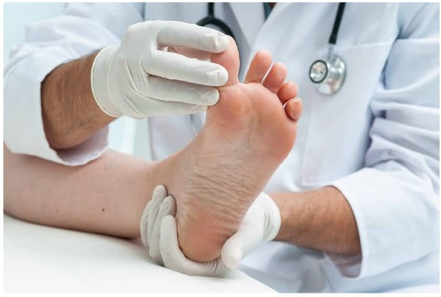 doctor exaiming a foot