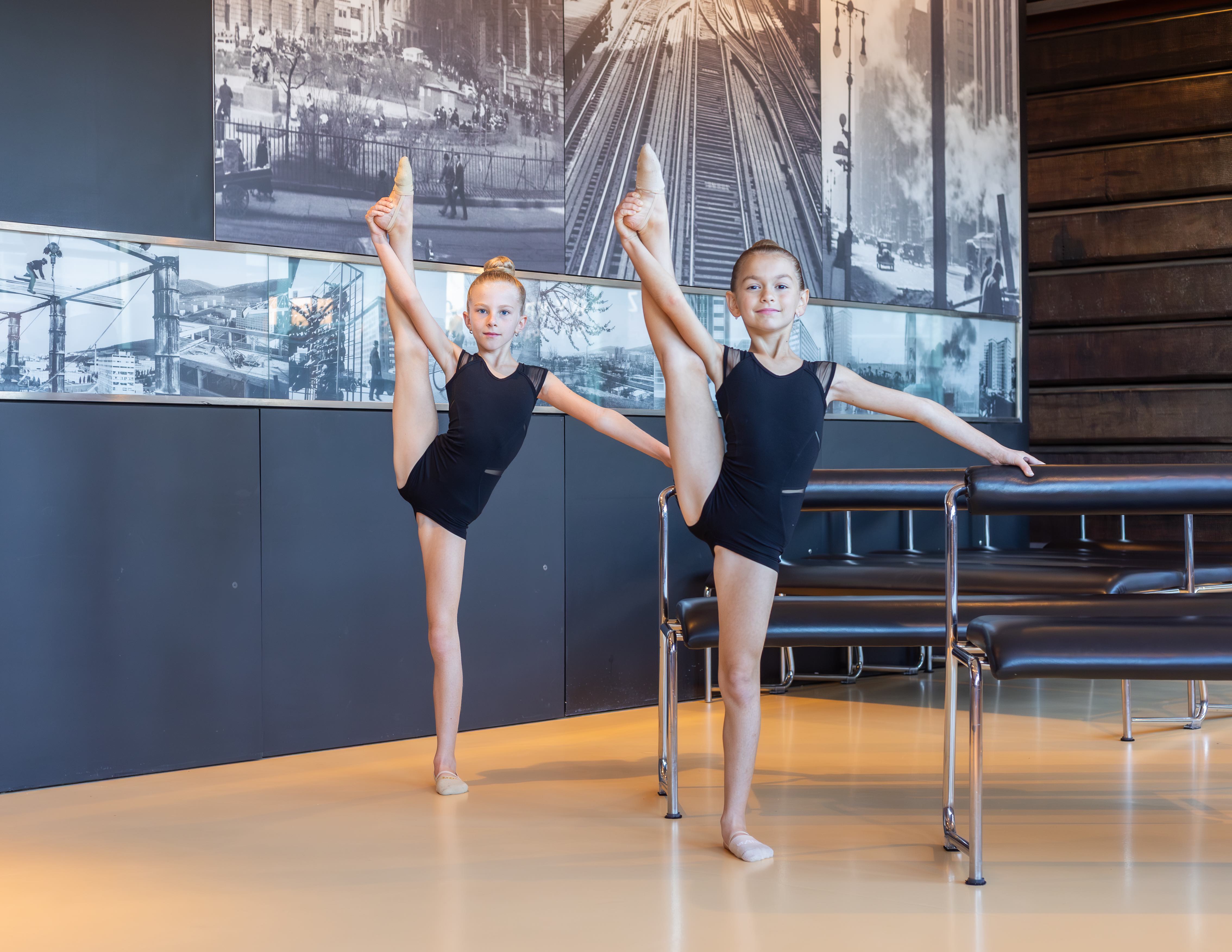 group of rhythmic gymnasts with red balls posing