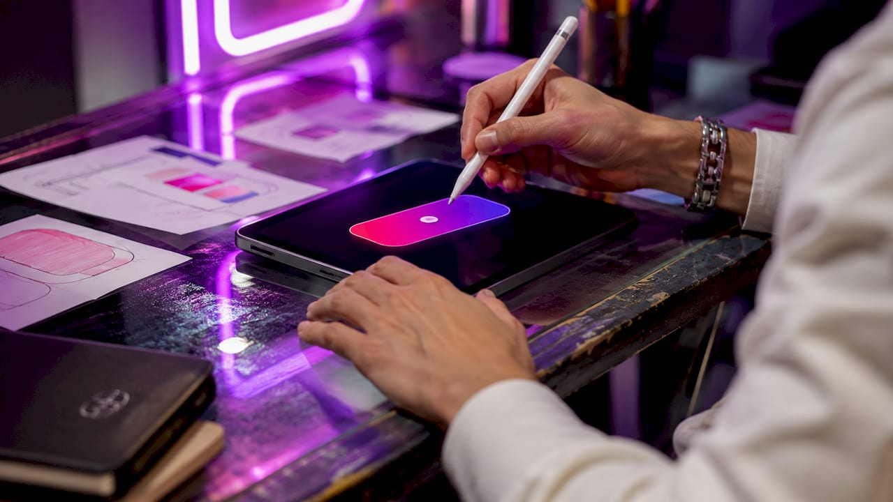 Close-up of hands editing vibrant gradient button
