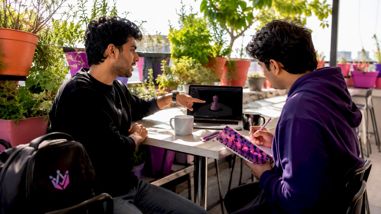 Programmers collaborating on 3D UX design