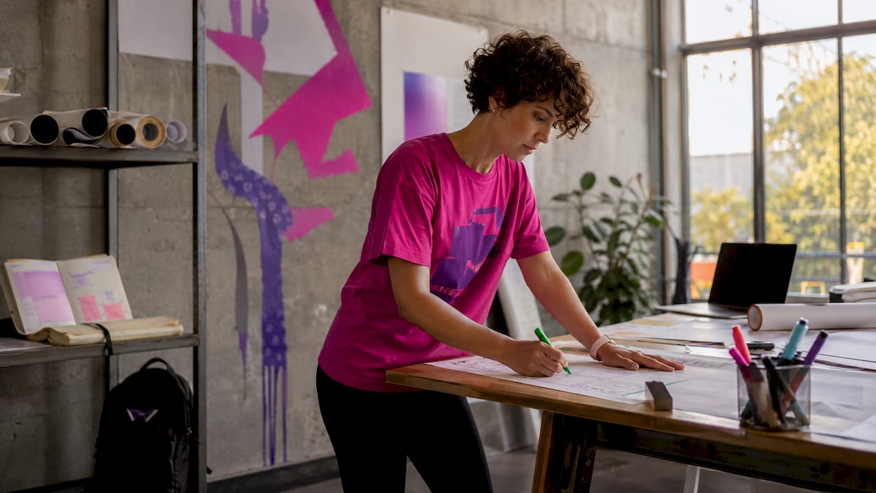 Designer working with brutalist architectural design sketches