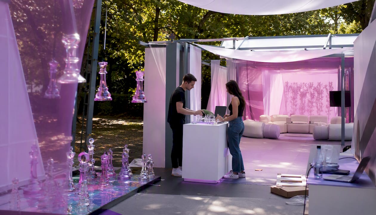Open startup booth layout showing three zones