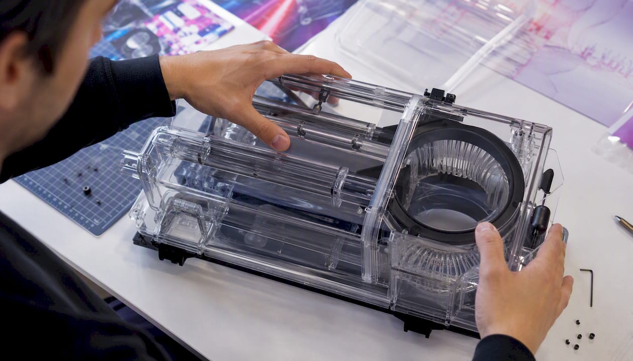 Hands adjusting transparent airflow chamber