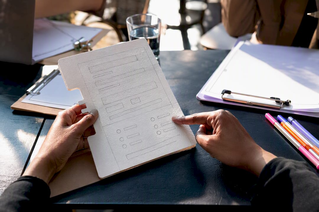 Hands testing inclusive microcopy on prototype form
