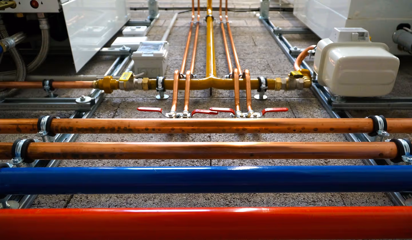 A close up view of a complex pipe installation from Maine Preventative Maintenance.