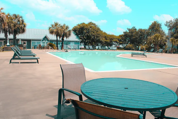 pool with table and chairs