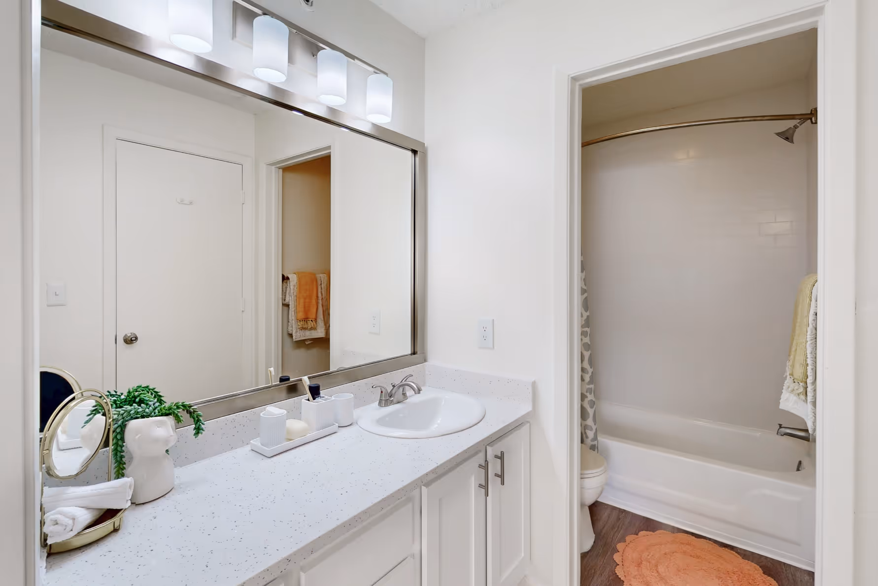 Bathroom with vanity mirror and tub