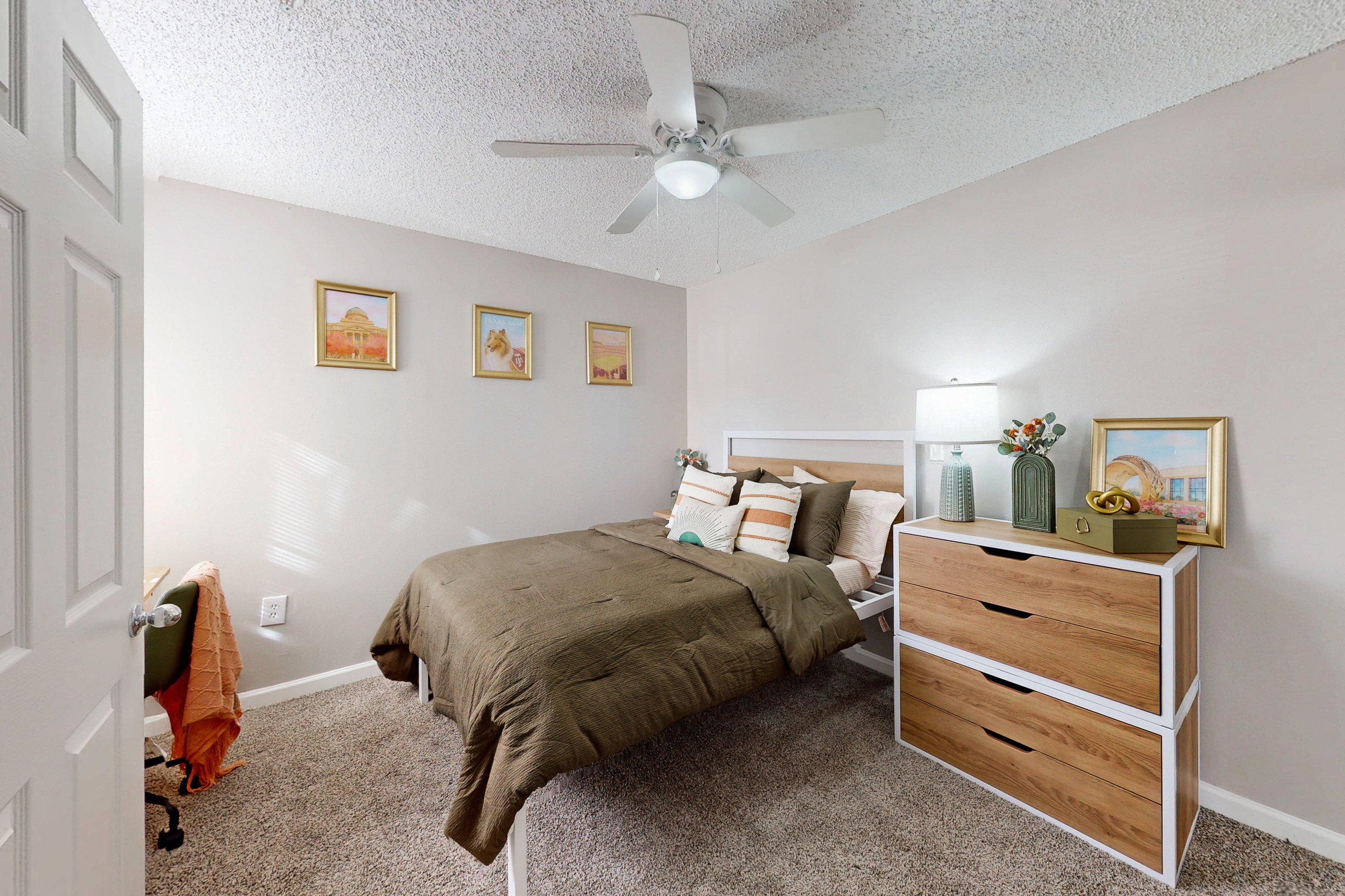 kitchen with stainless steel dishwasher, sink, white cabinets, and view of laundry room with white appliances