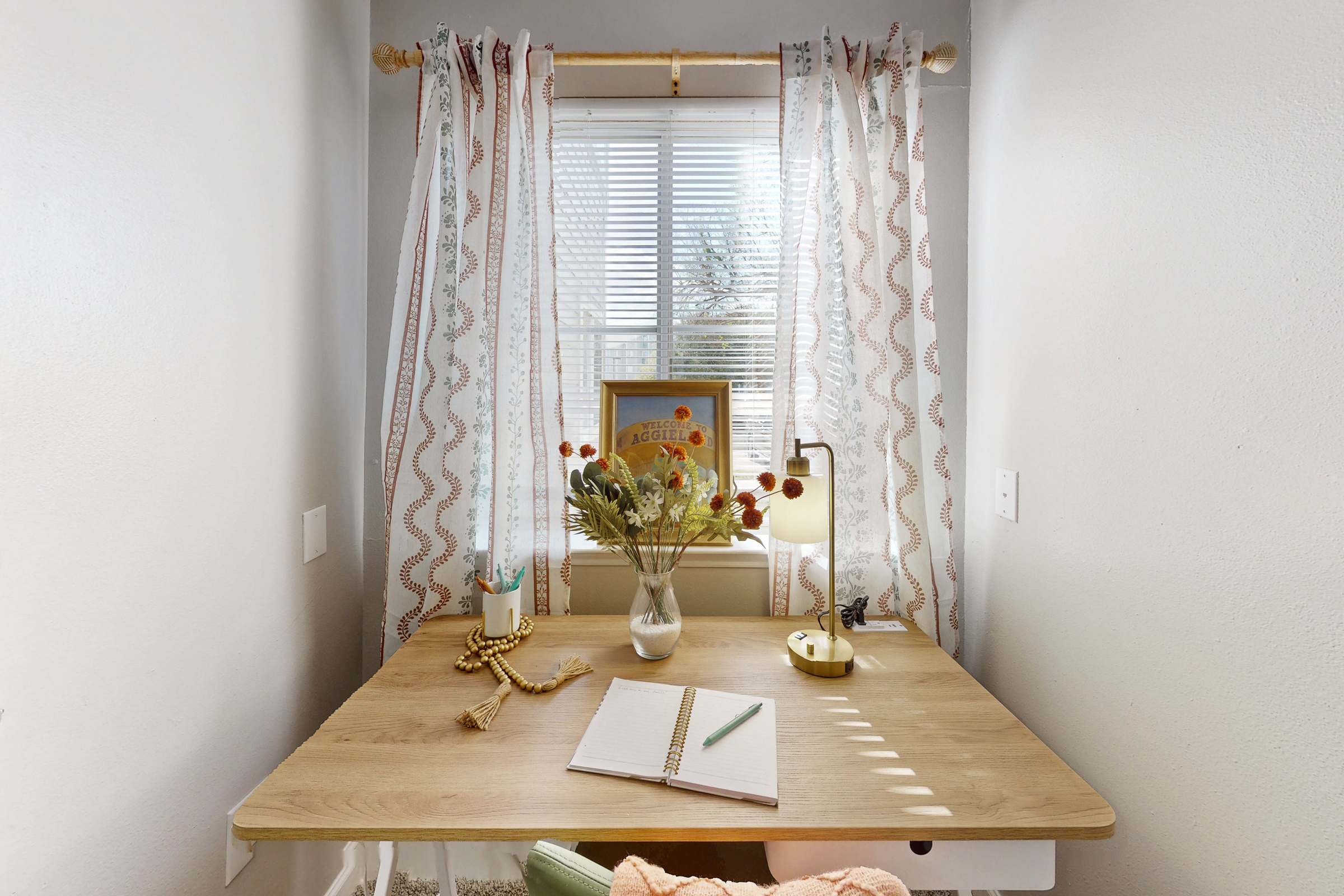 kitchen with stainless steel refrigerator, over, and microwave and view of laundry room with white appliances and shelf