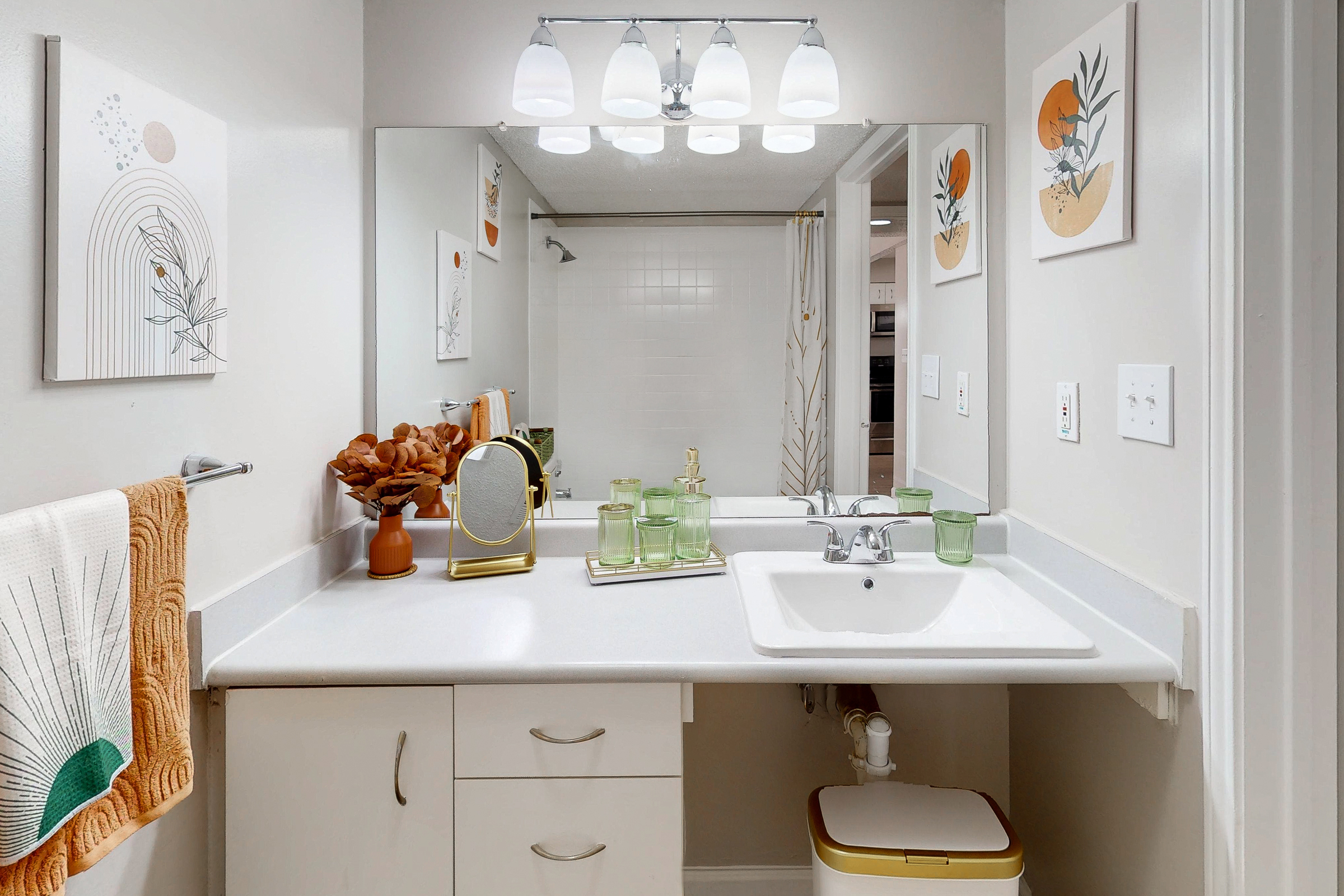 large bedroom with bed, closet with hangers, desk and window