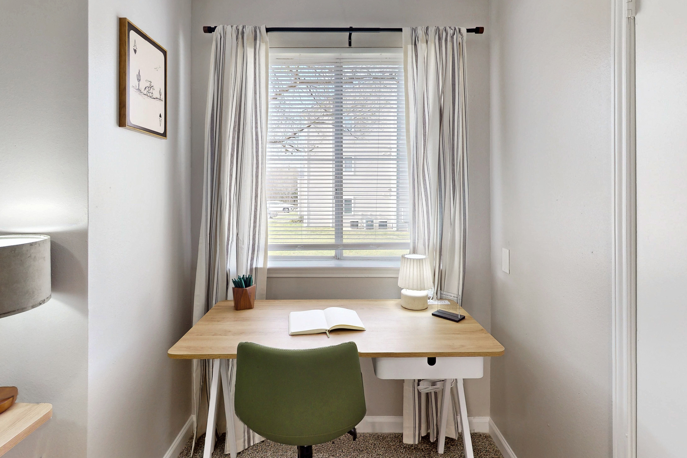 Bathroom with vanity mirror and white drawers and cabinets 