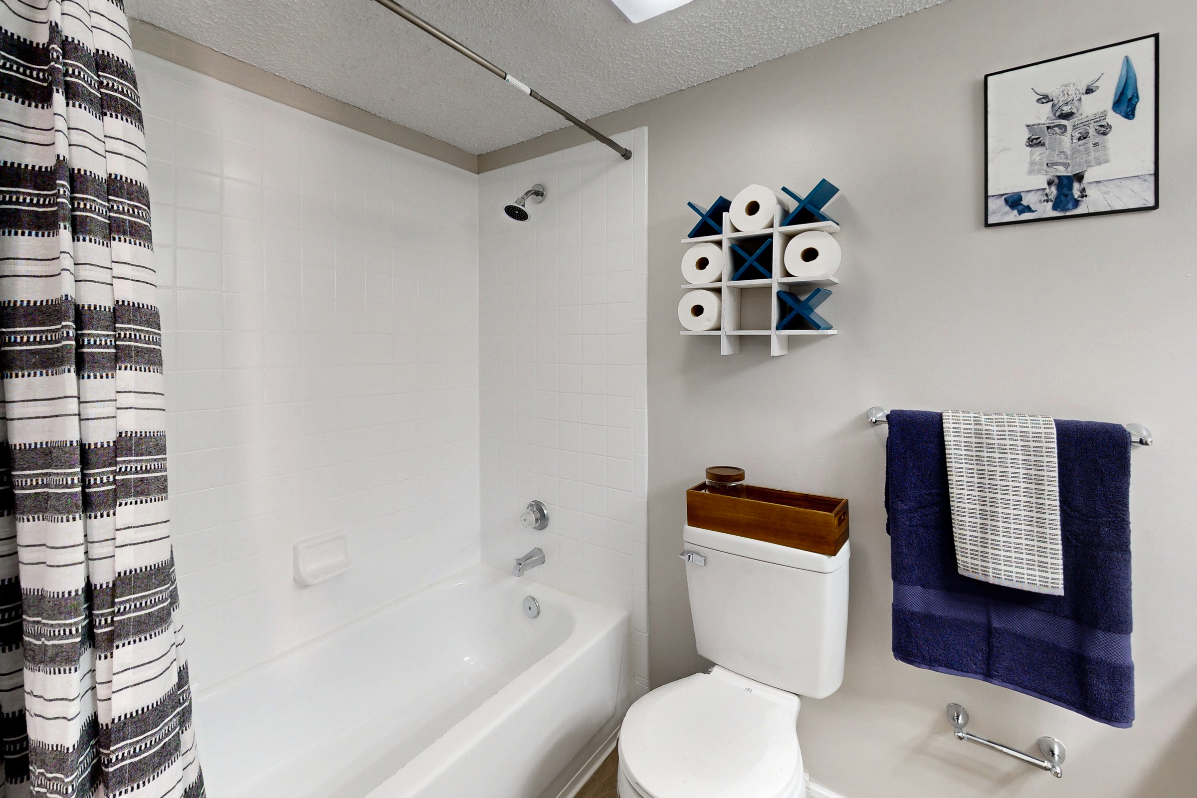 Bathroom with vanity mirror and white drawers and cabinets 