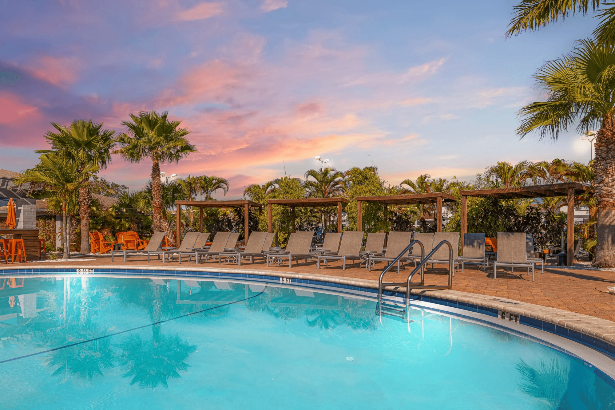 Carillon Bay pool with a sunset backdrop