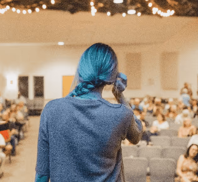 student speaking in front of audience