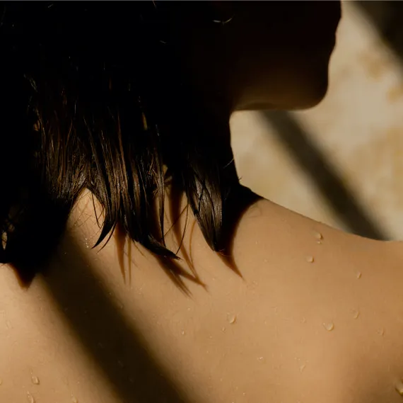 A woman looks over her shoulder