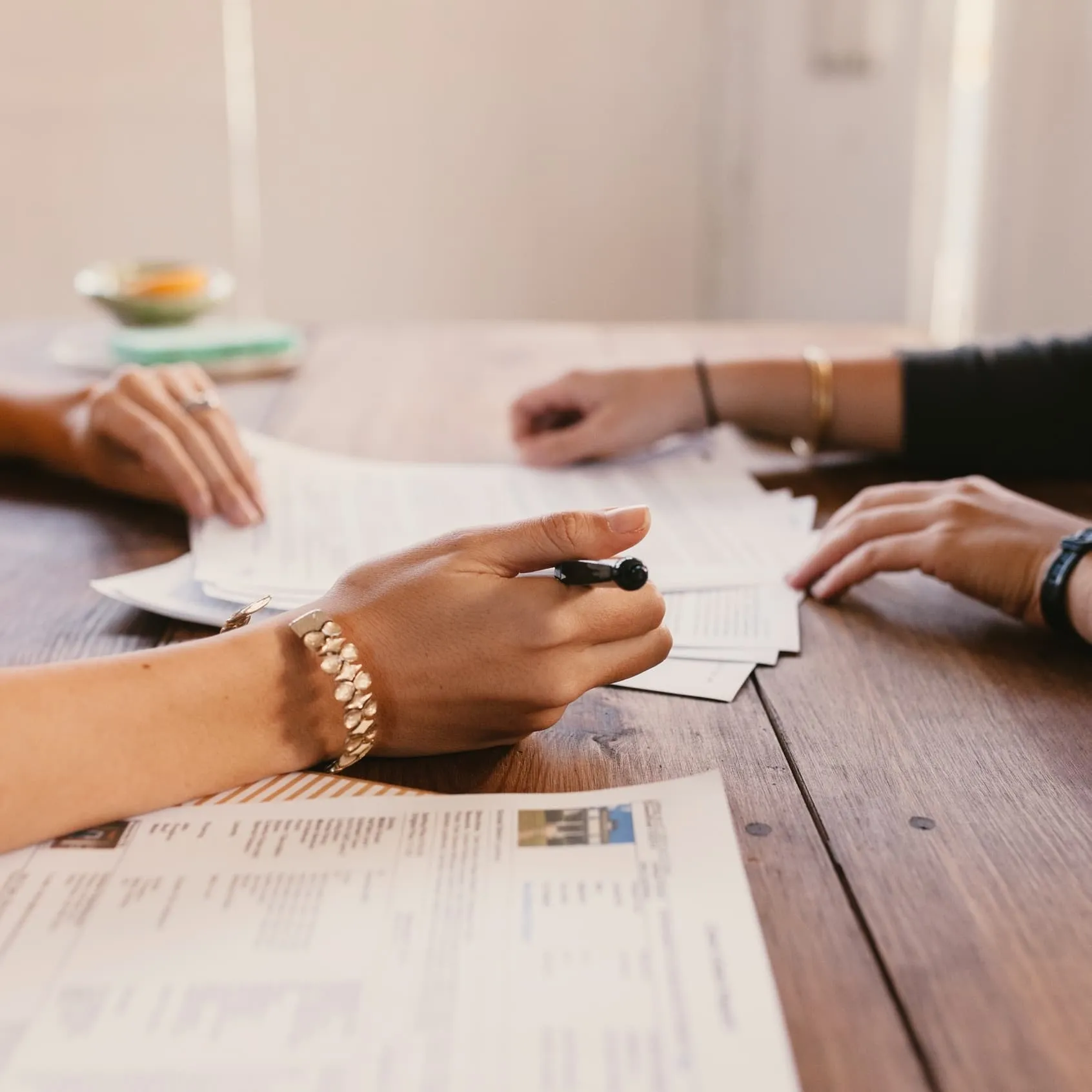 Two people sit at a table working together