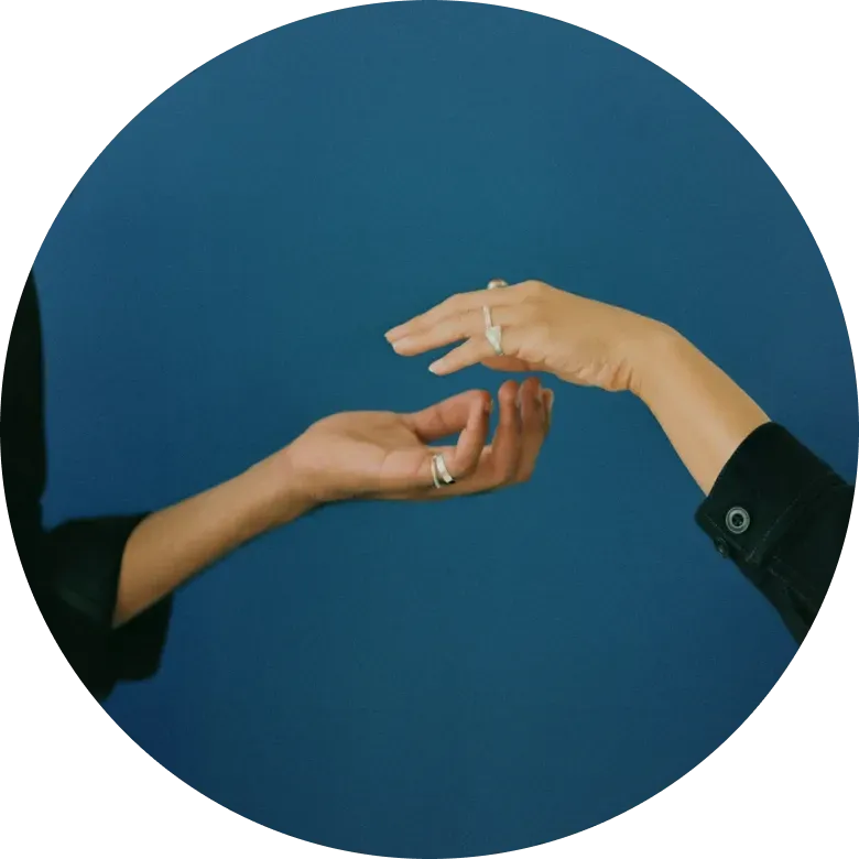 two hands reaching for each other