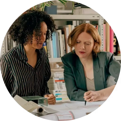 Two women reviewing documents