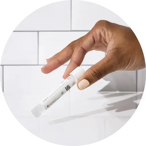 Hand holding a test tube