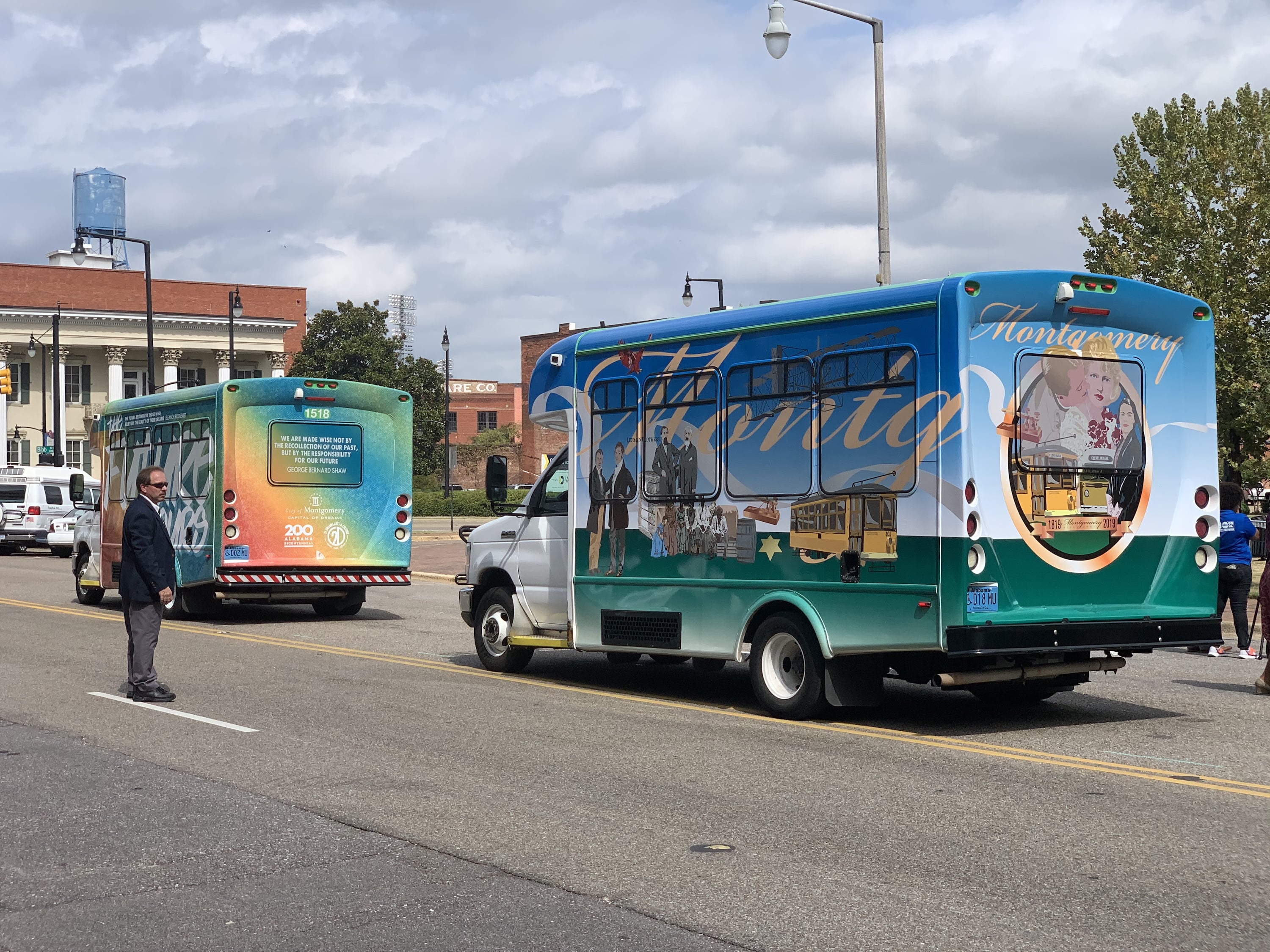 Panel discussion with five people seated on stage, engaging in conversation.