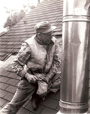 Edward Wiesbrook, our great grandfather, repairing a rooftop vent.