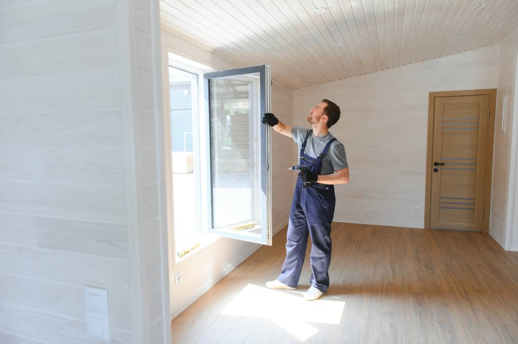 Man checking newly installed window