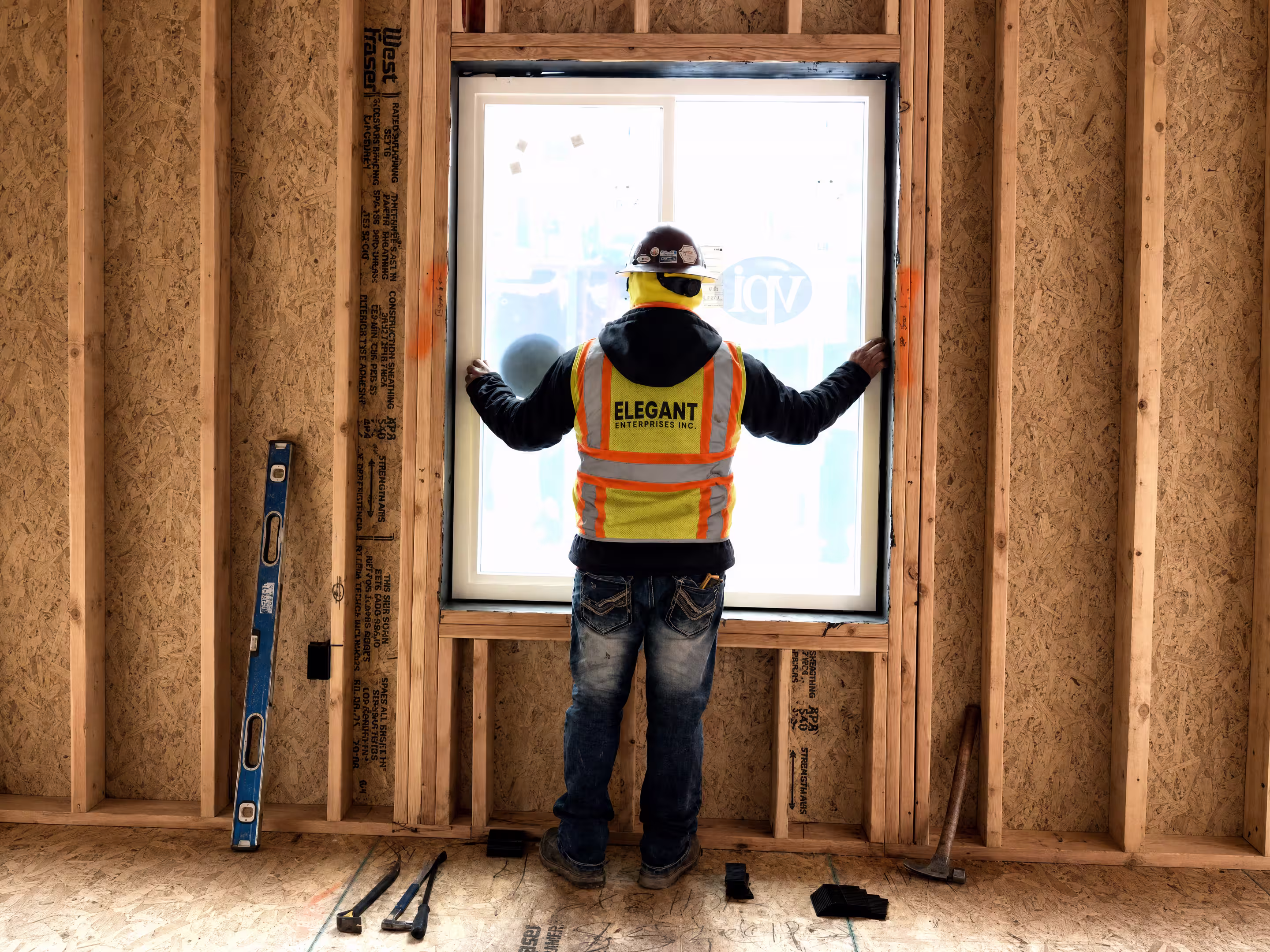 Construction worker installing a window
