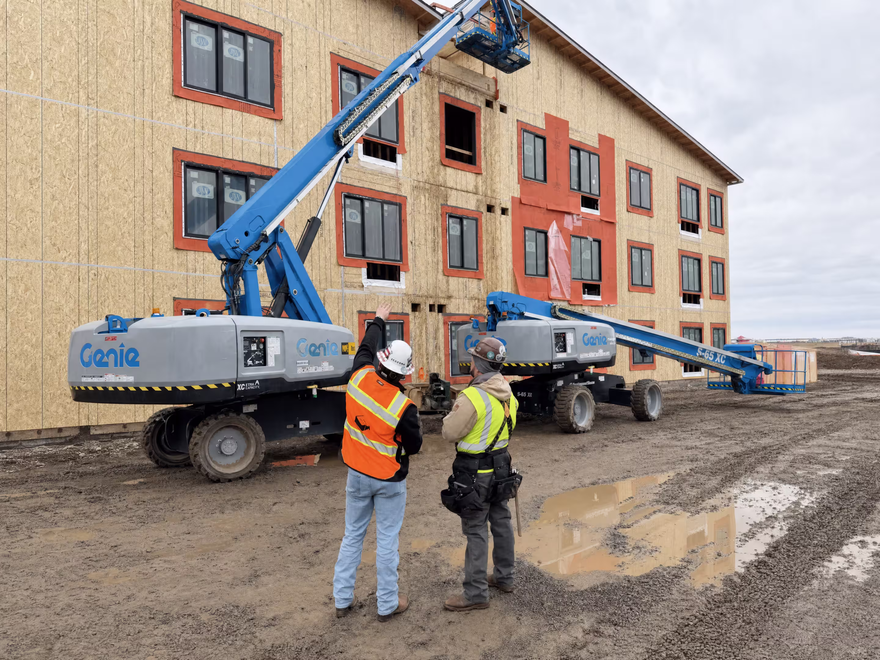 construction site with windows and waterproofing being installed