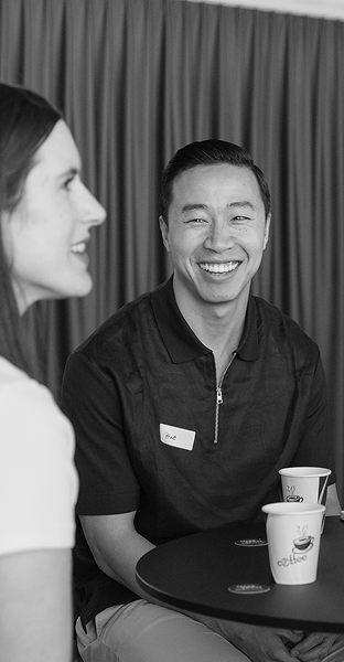 Photo of two Hello 50:50 World ambassadors smiling and talking together during one of our community events.