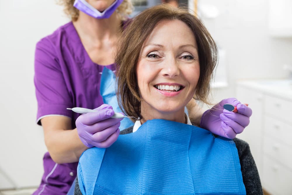 photo of an older female patient at the dentist