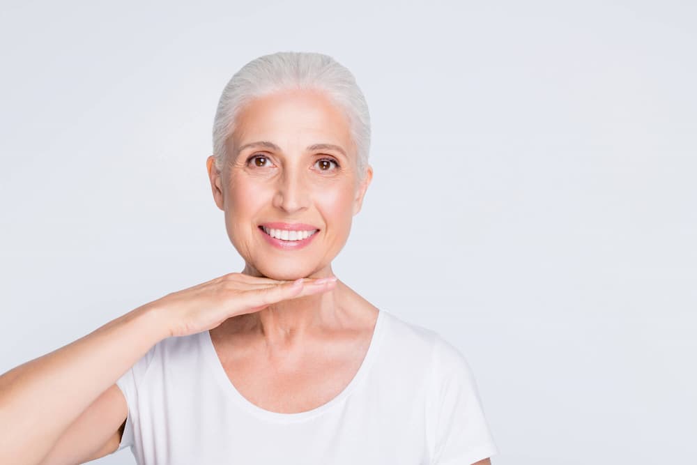 photo of an older woman showing off her beautiful smile